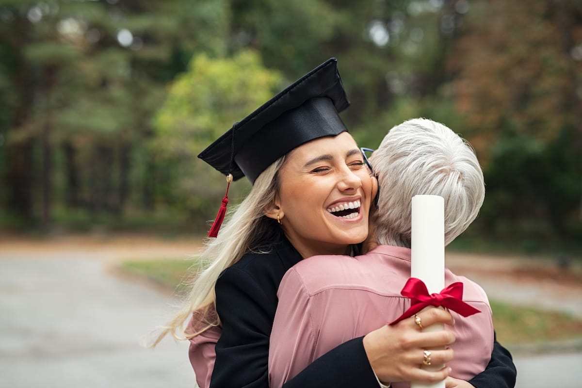 graduate-girl-hugging-mother-2022-02-02-04-48-58-utc